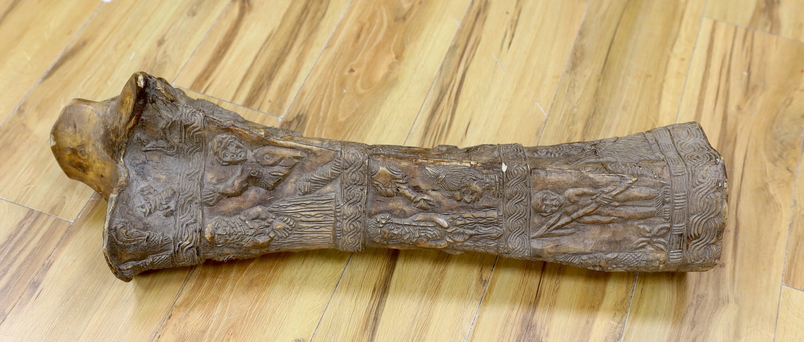 An unusual Benin-style carved elephant femur, Nigeria, 73cm high